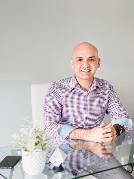 Amin Ahmed, founder of ClarityMode, at his desk